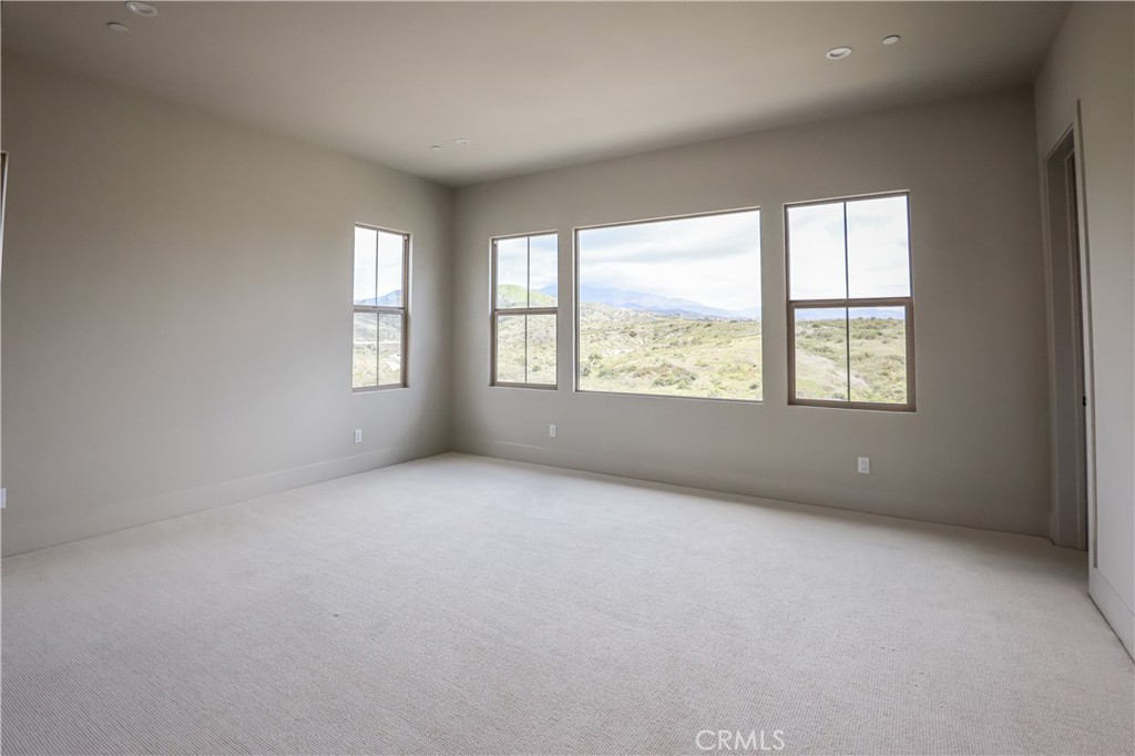118 Mossvine Irvine, CA 92618 - Photo 11 of 31 an empty room with windows and closet