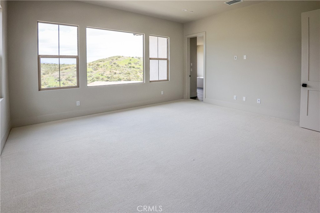 118 Mossvine Irvine, CA 92618 - Photo 12 of 31 an empty room with windows and closet