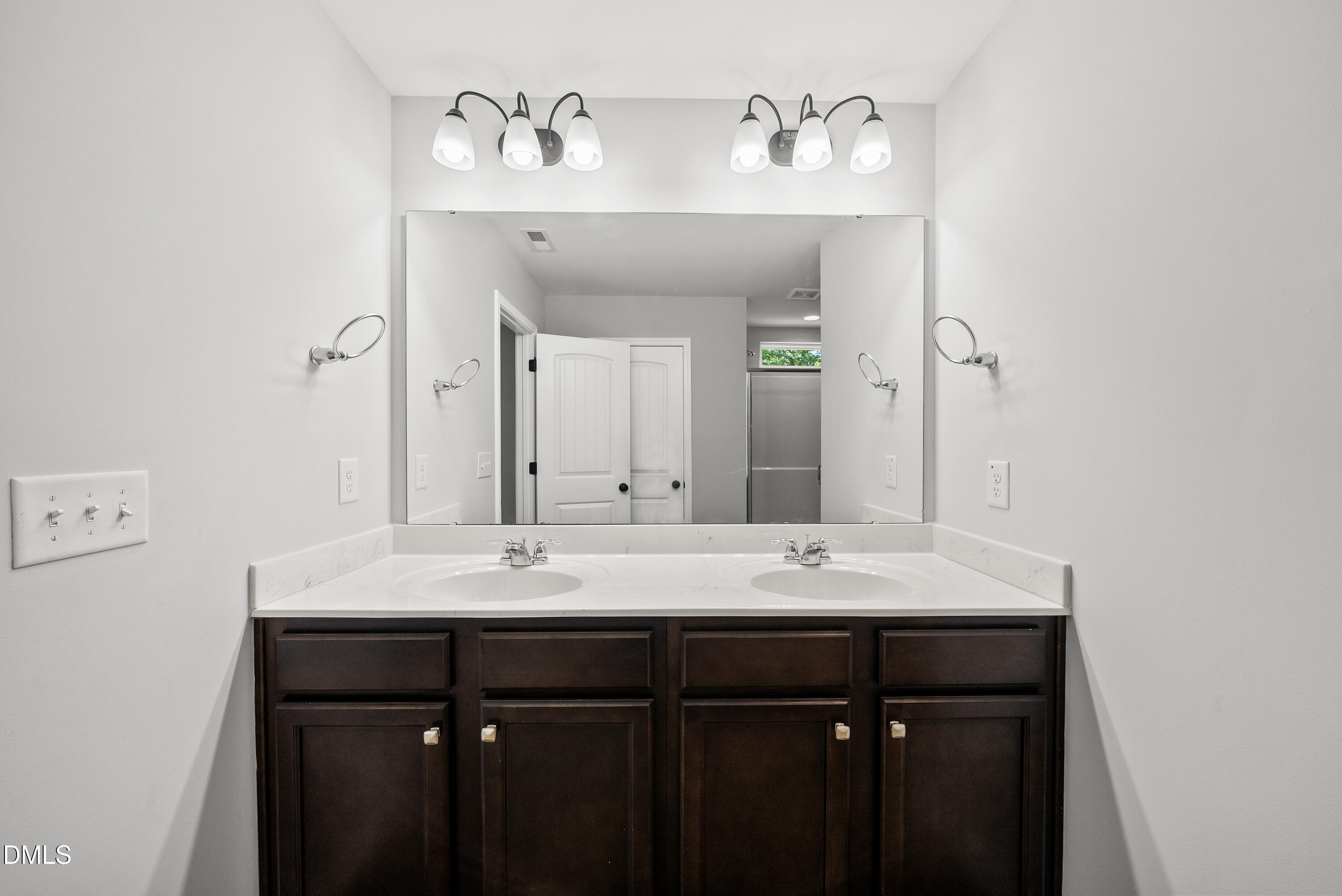 2816 Elsa Drive Raleigh, NC 27610 - Photo 27 of 35 a bathroom with a sink and a mirror