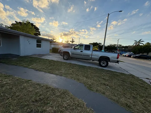 a view of a car in front of a house