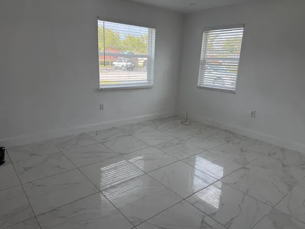 an empty room with windows