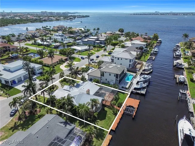 an aerial view of a house with outdoor space