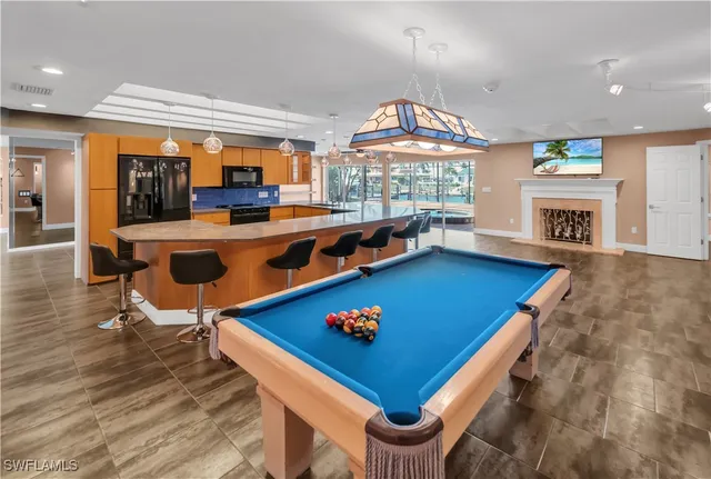 an open kitchen with table and chairs