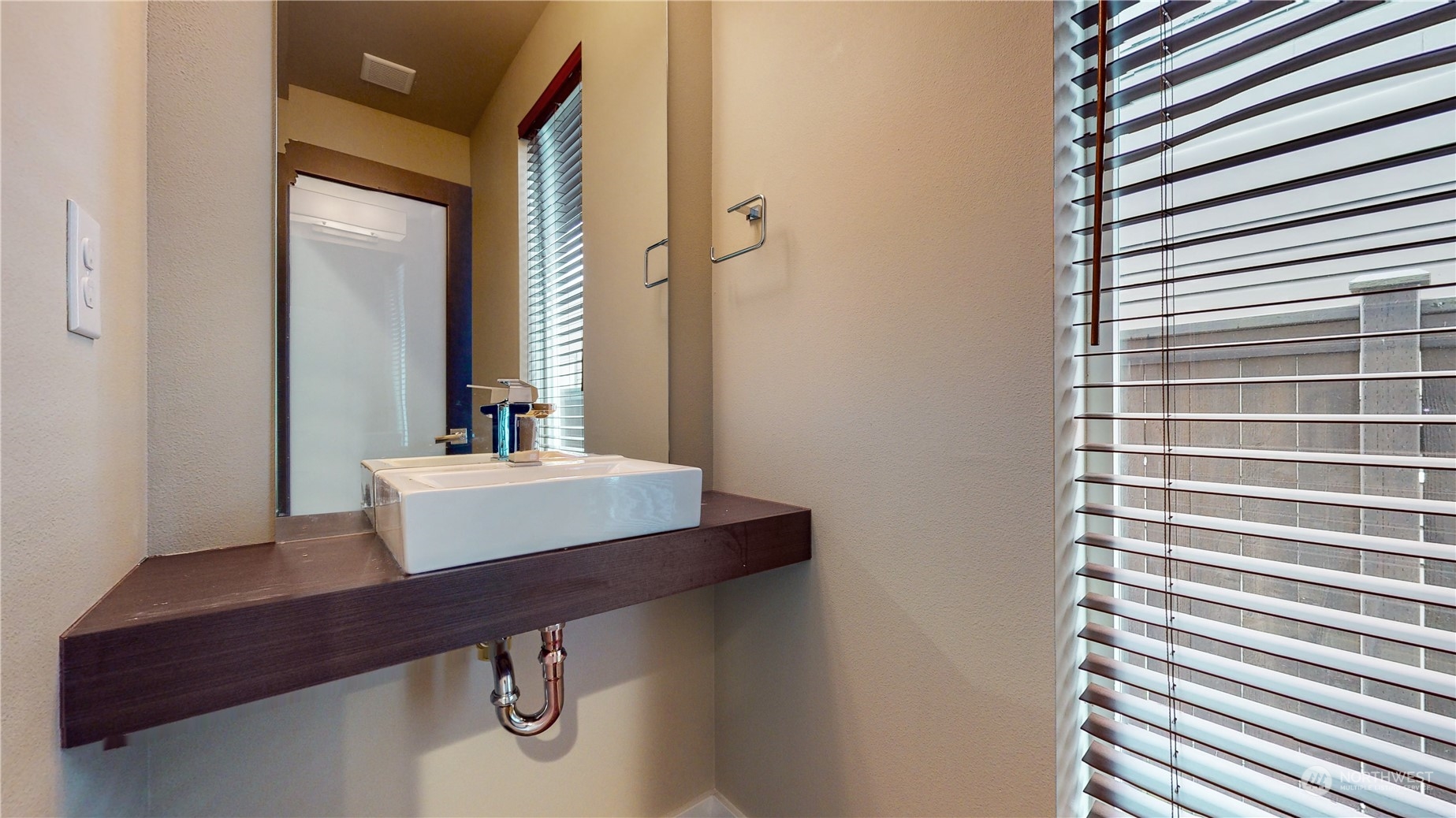 17009 42nd Drive Southeast Bothell, WA 98012 - Photo 11 of 26 a bathroom with a sink and a mirror