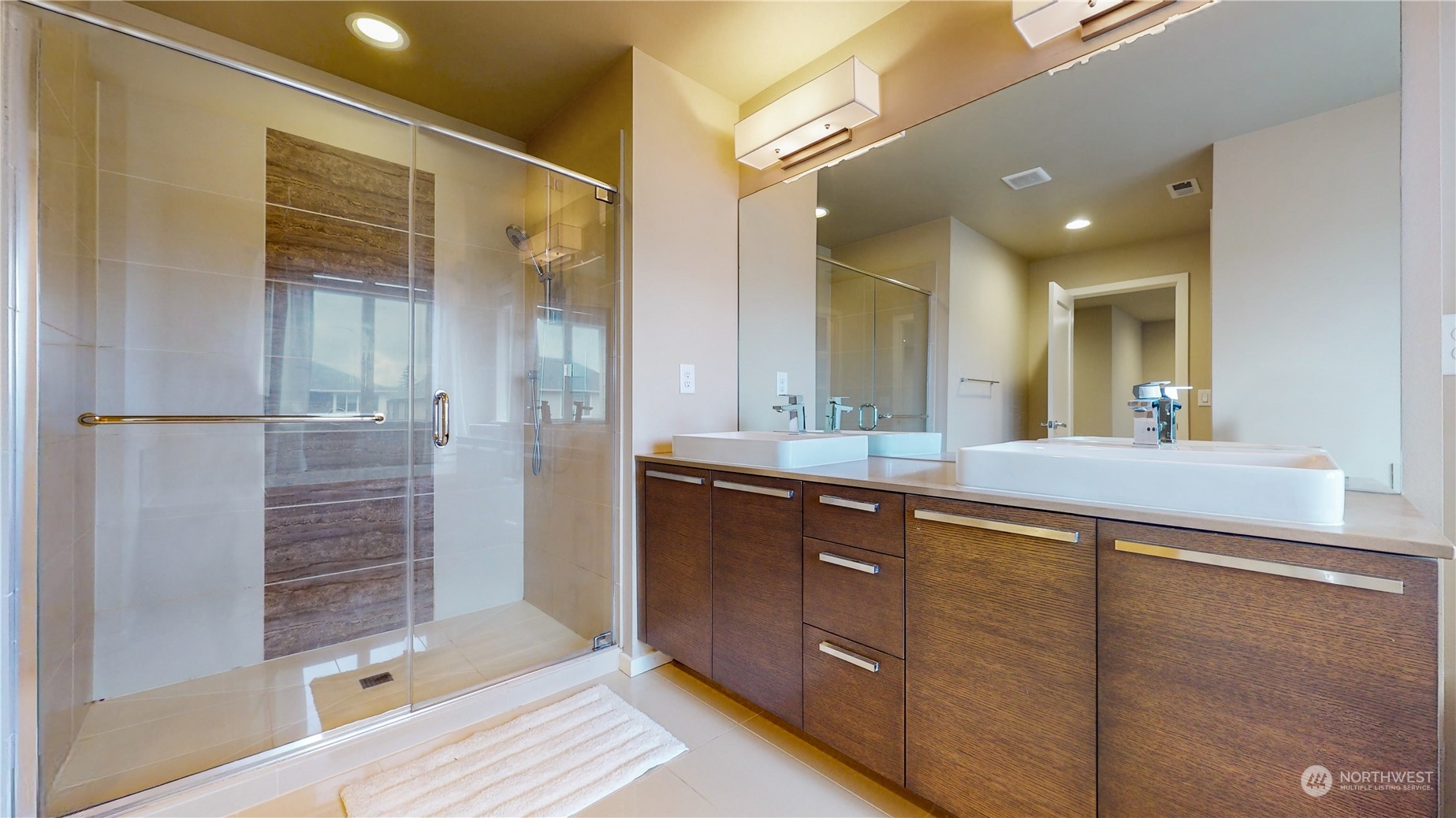 17009 42nd Drive Southeast Bothell, WA 98012 - Photo 15 of 26 a bathroom with a shower sink and mirror
