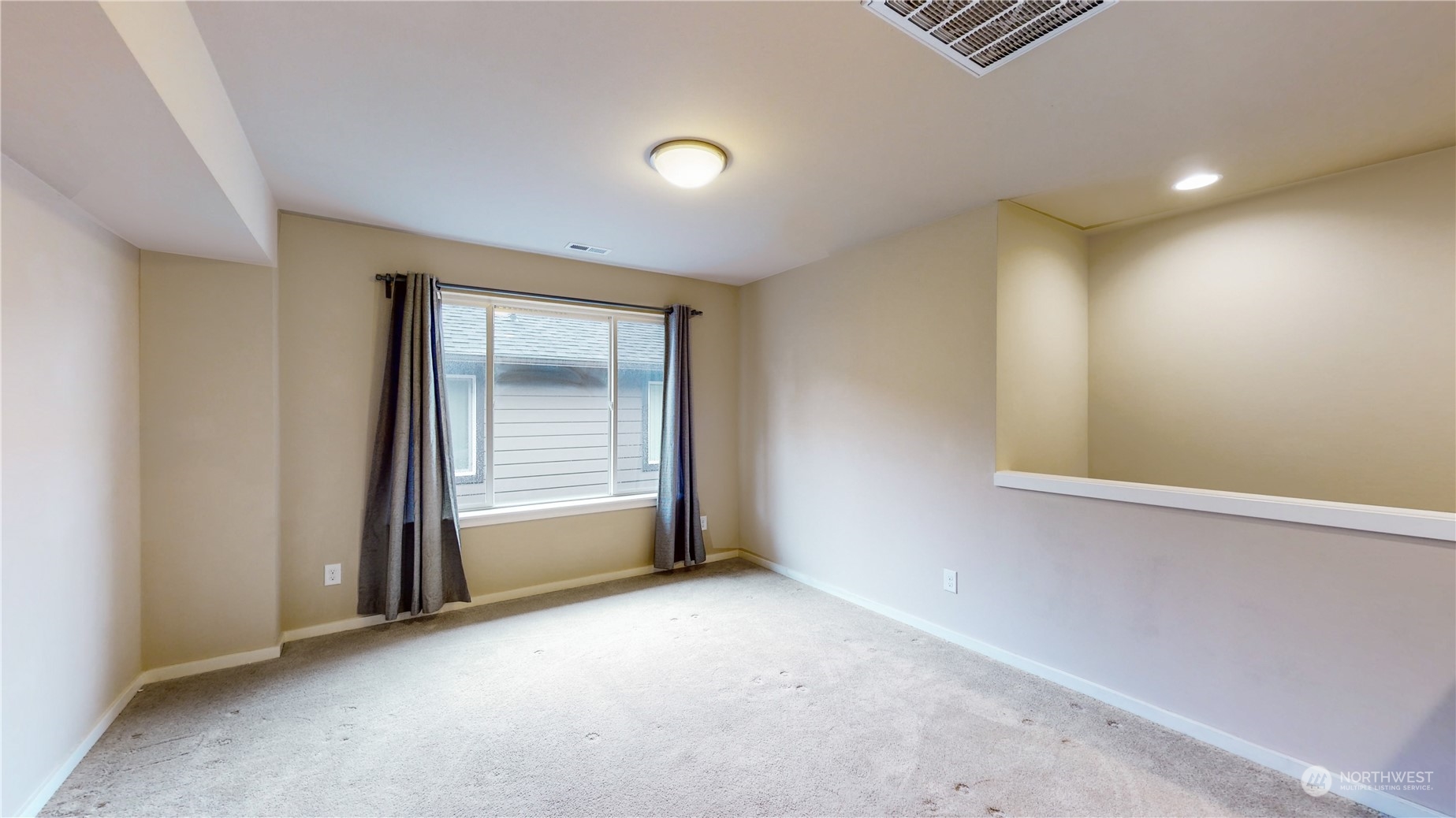 17009 42nd Drive Southeast Bothell, WA 98012 - Photo 16 of 26 an empty room with windows