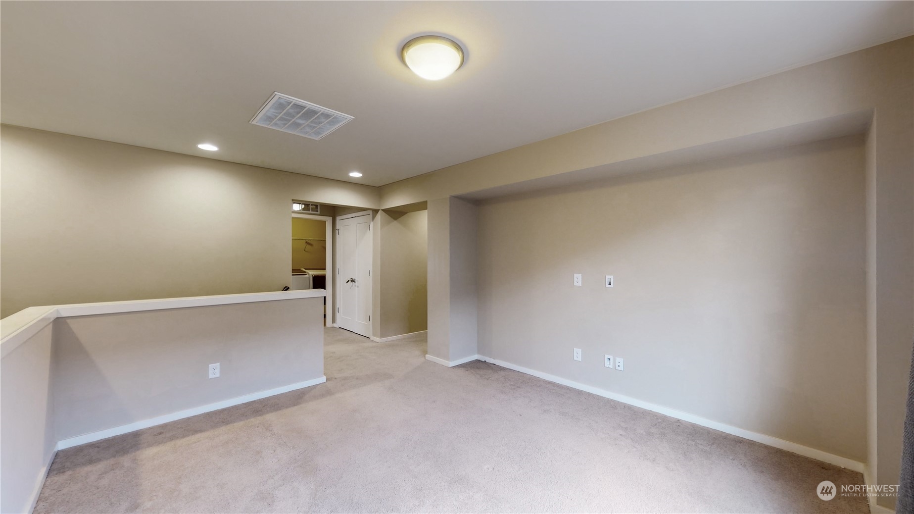 17009 42nd Drive Southeast Bothell, WA 98012 - Photo 17 of 26 an empty room with wooden floor and windows