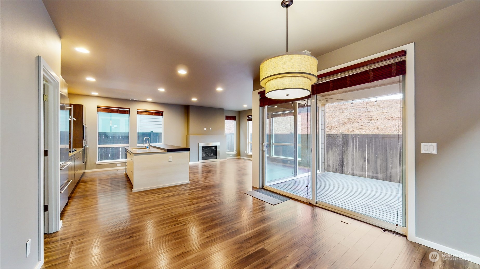17009 42nd Drive Southeast Bothell, WA 98012 - Photo 2 of 26 a view of a living room and floor to ceiling window with wooden floor