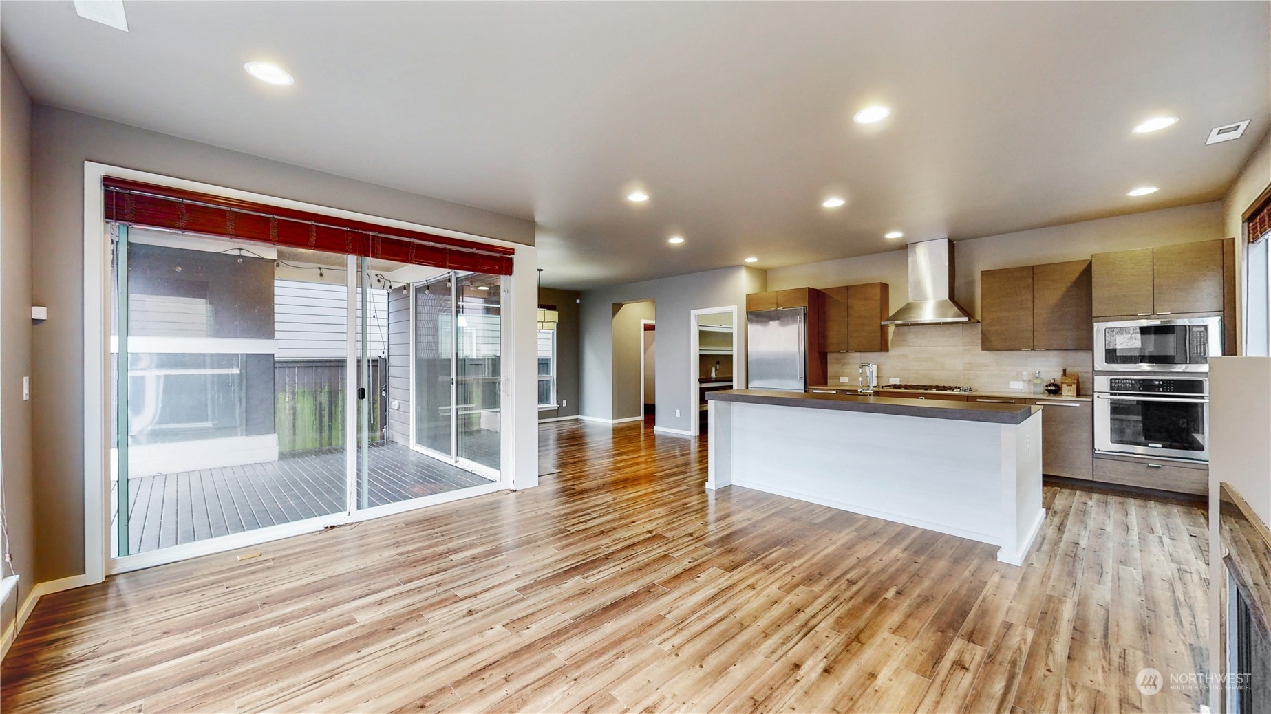 17009 42nd Drive Southeast Bothell, WA 98012 - Photo 3 of 26 a view of kitchen with kitchen island wooden floor and stainless steel appliances