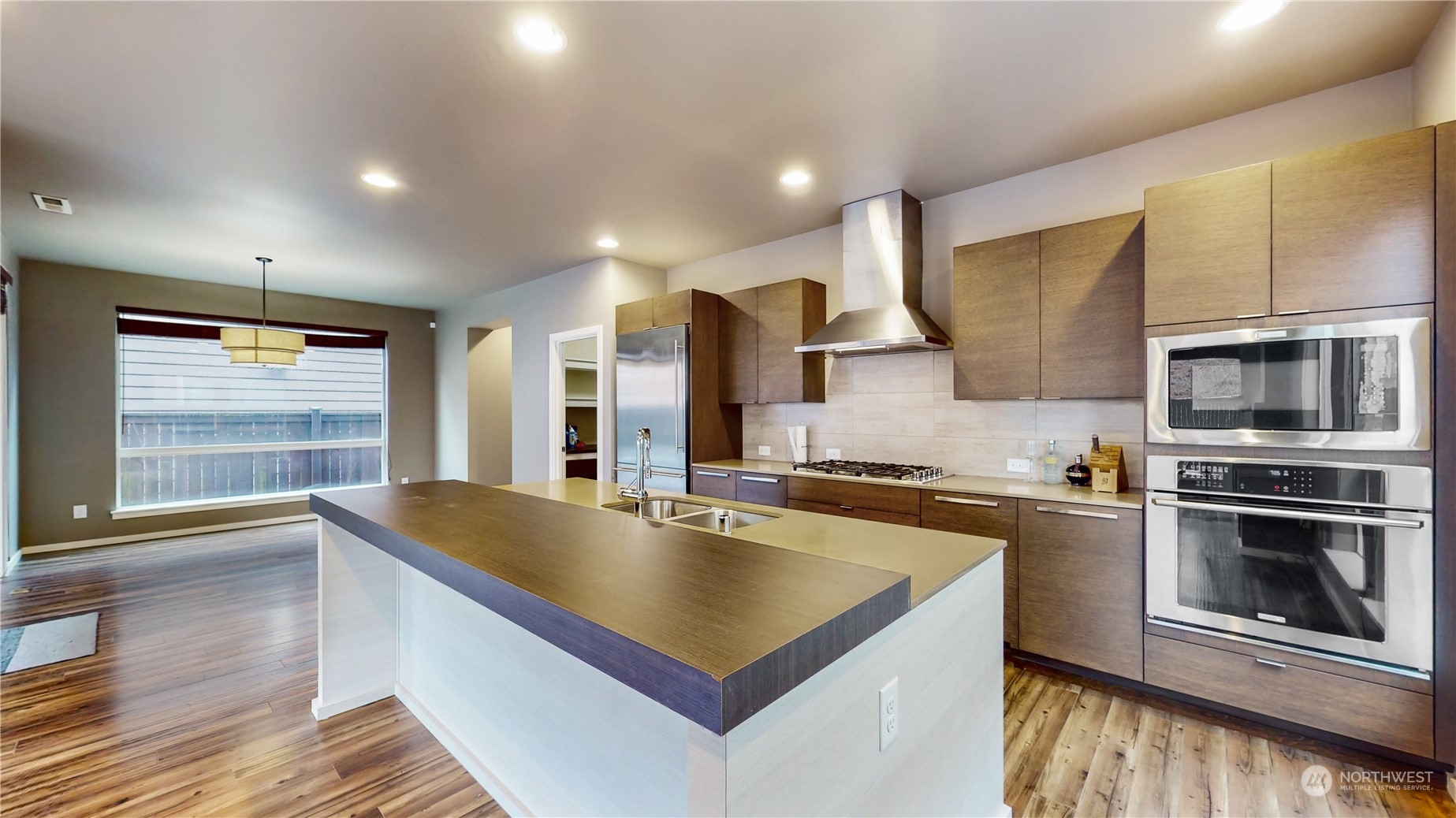 17009 42nd Drive Southeast Bothell, WA 98012 - Photo 6 of 26 a kitchen with stainless steel appliances granite countertop a sink a stove and a microwave