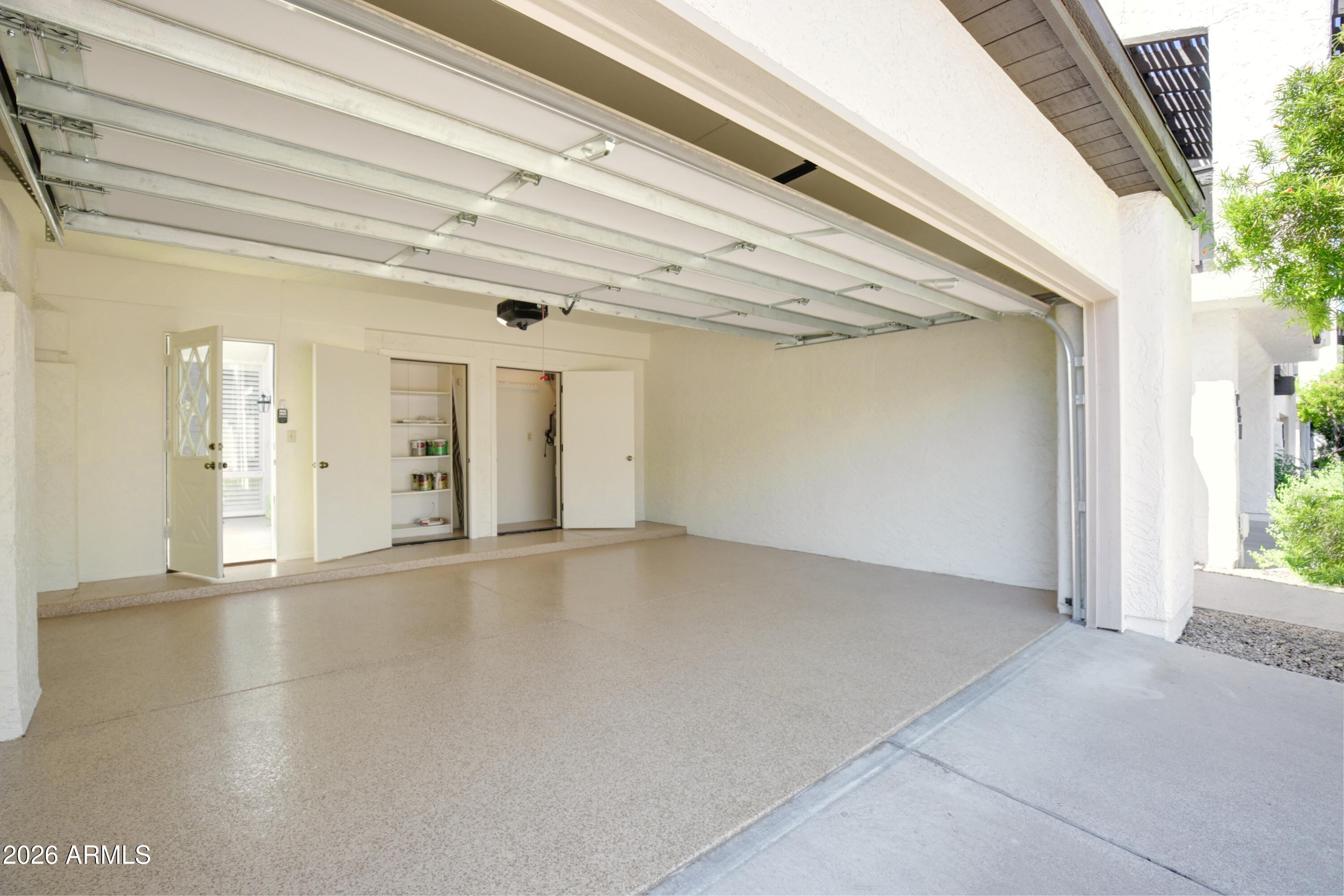 4438 East Camelback Road, Unit 149 Phoenix, AZ 85018 - Photo 47 of 65 Garage, new door, opener, epoxy floor