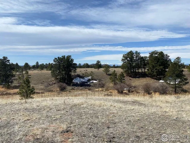 a view of a covered with snow in front of yard