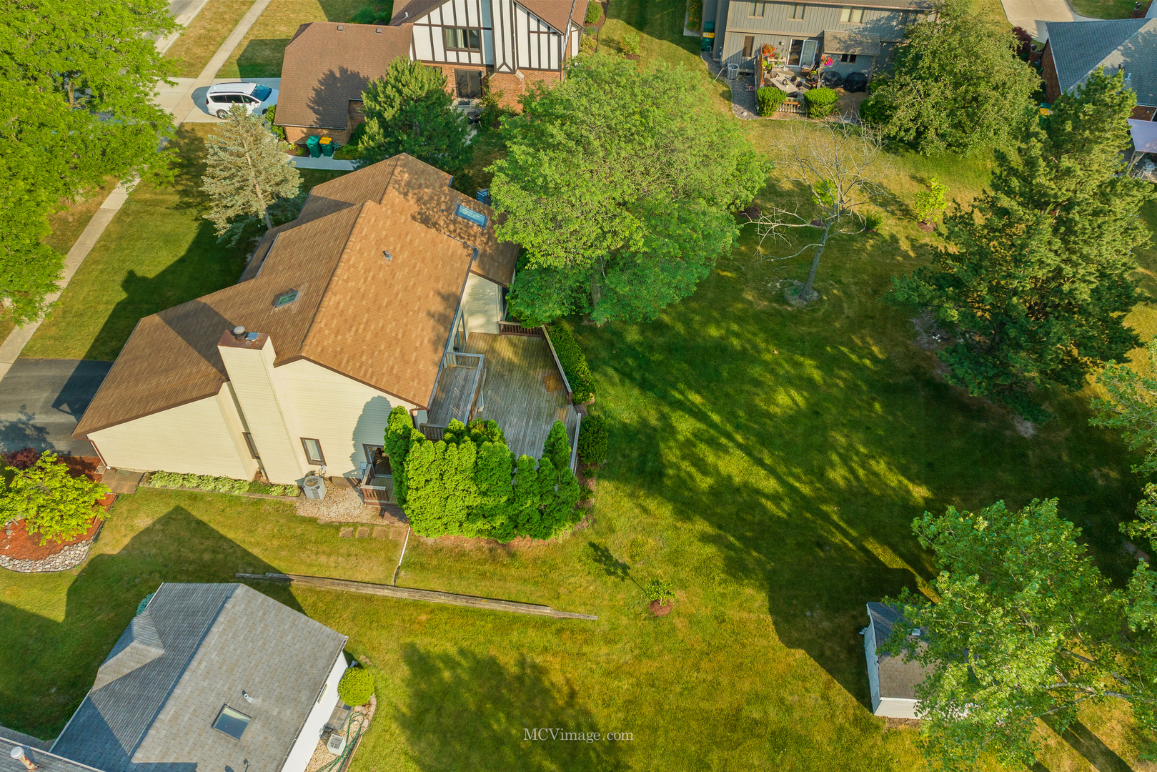 89 West Logan Street Lemont, IL 60439 - Photo 2 of 2 an aerial view of a house with swimming pool and garden