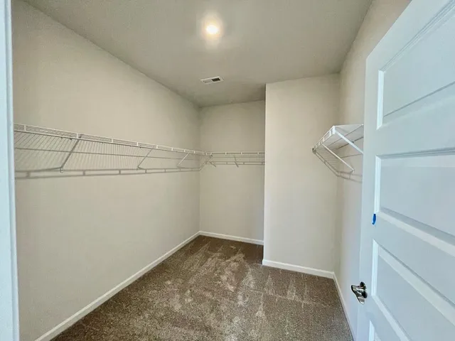 a view of a room with racks on the wall