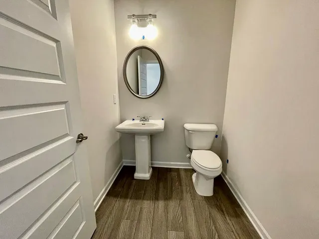 a bathroom with a toilet and a sink