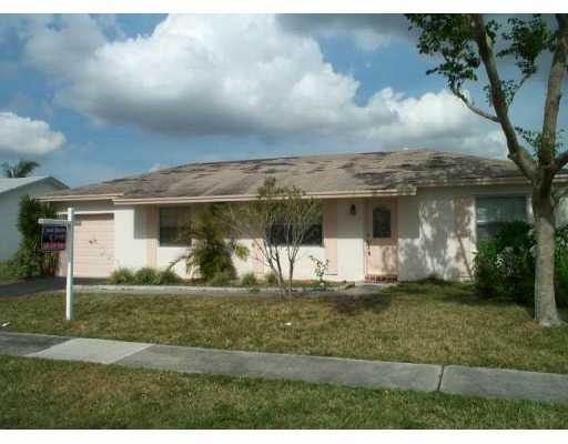 9345 Gettysburg Road, Unit BU Boca Raton, FL 33434 - Photo 1 of 1 a front view of a house with a yard