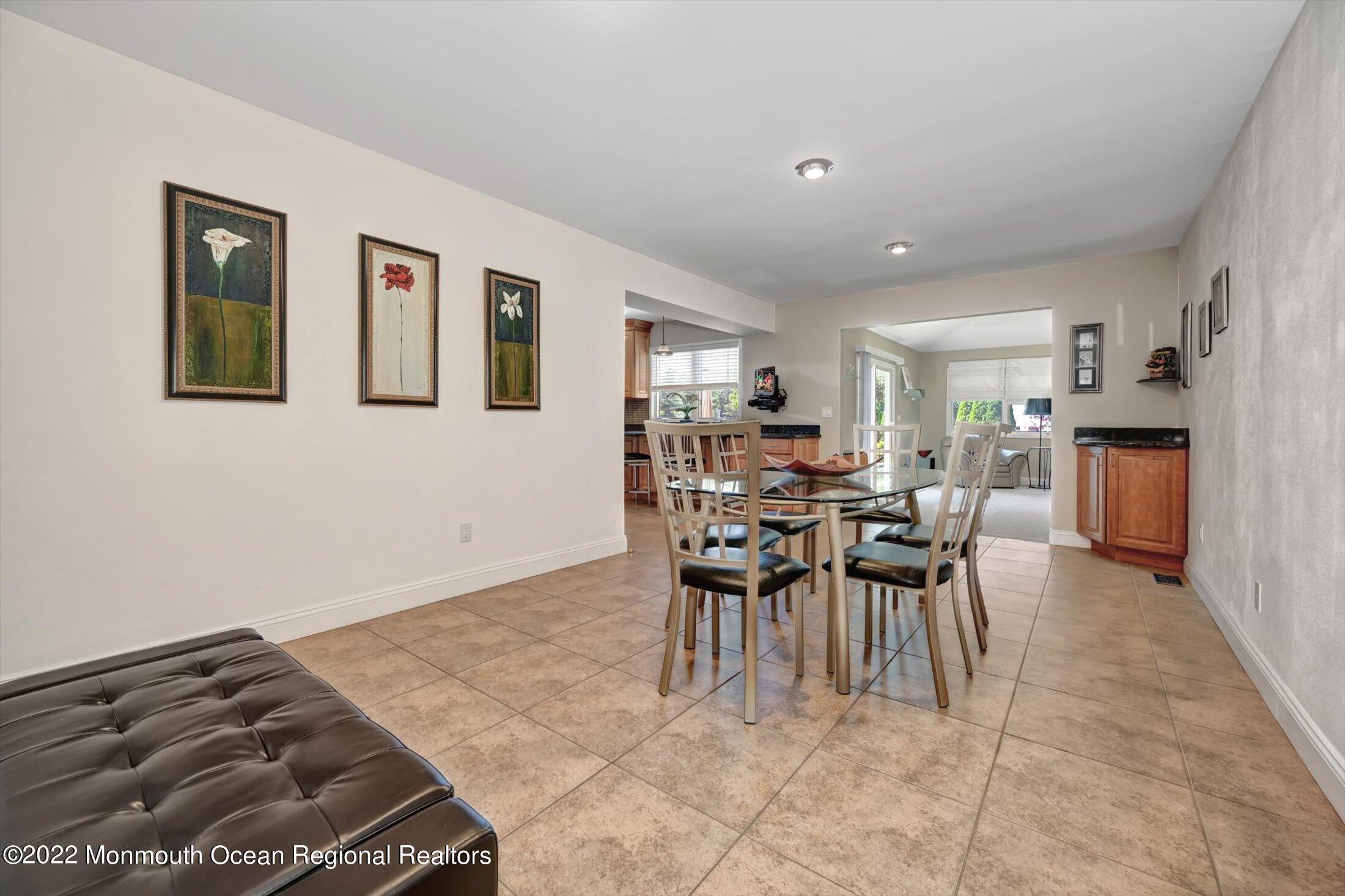 4 Sussex Road Morganville, NJ 07751 - Photo 16 of 55 a dining room with furniture and window