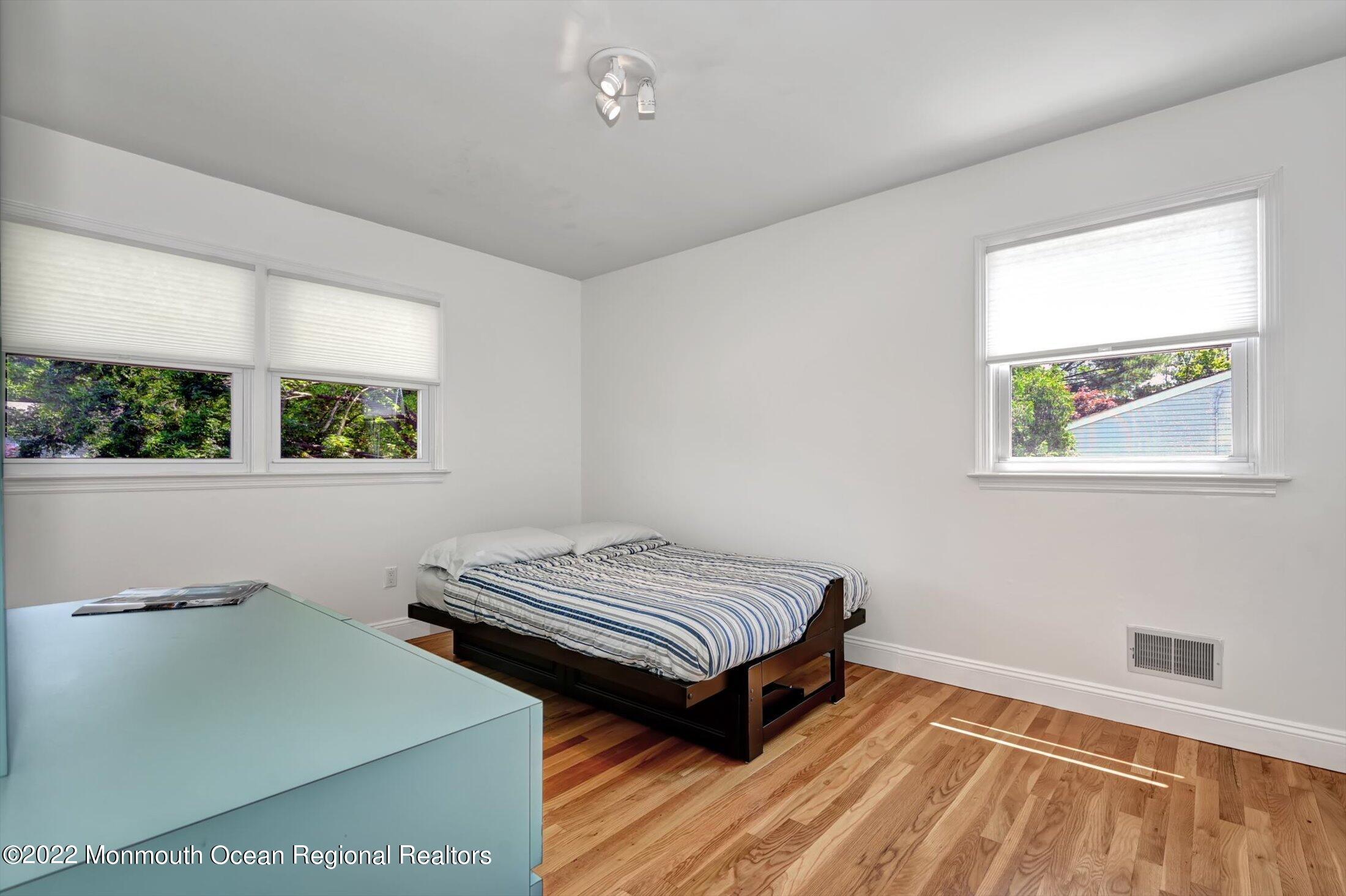 4 Sussex Road Morganville, NJ 07751 - Photo 26 of 55 a bedroom with a bed and a window