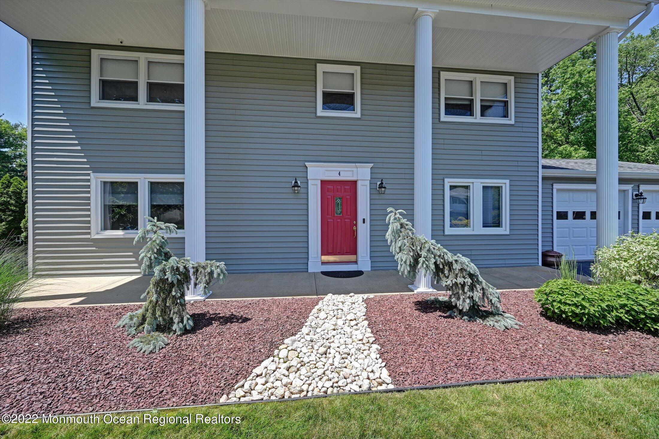 4 Sussex Road Morganville, NJ 07751 - Photo 3 of 55 a front view of a house with garden