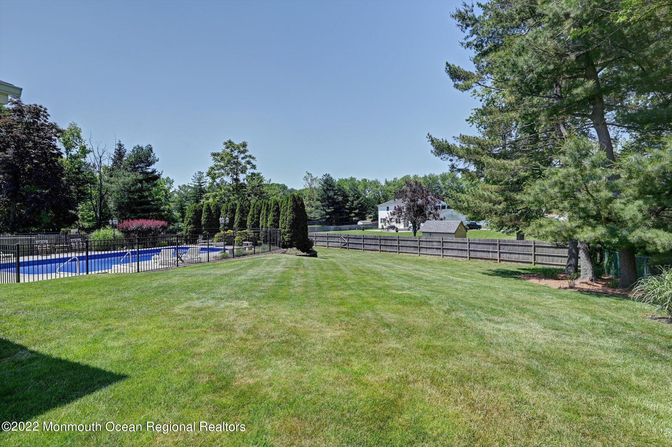 4 Sussex Road Morganville, NJ 07751 - Photo 36 of 55 a childrens park with lots of swings and slides