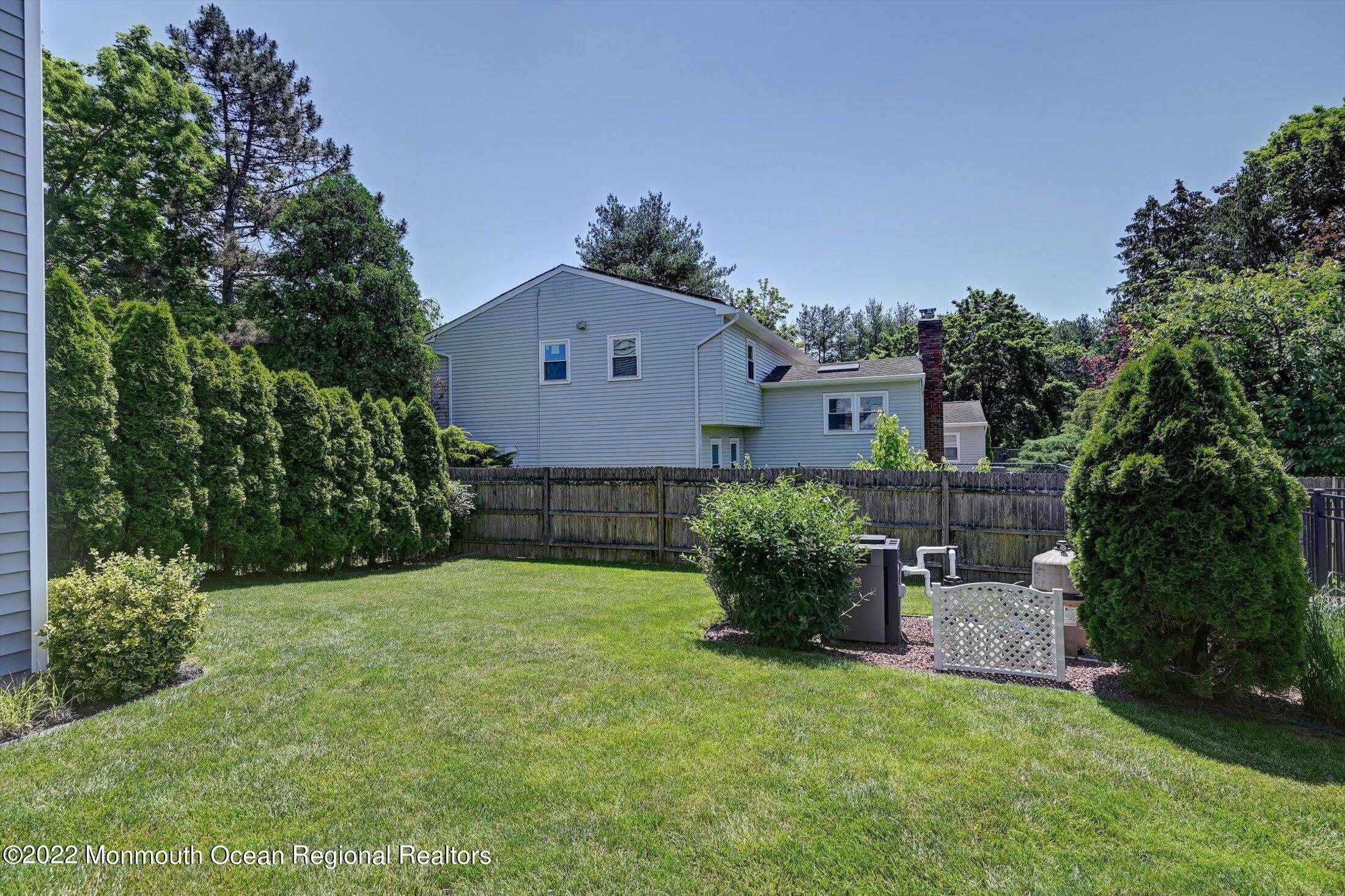 4 Sussex Road Morganville, NJ 07751 - Photo 38 of 55 front view of a house with a yard