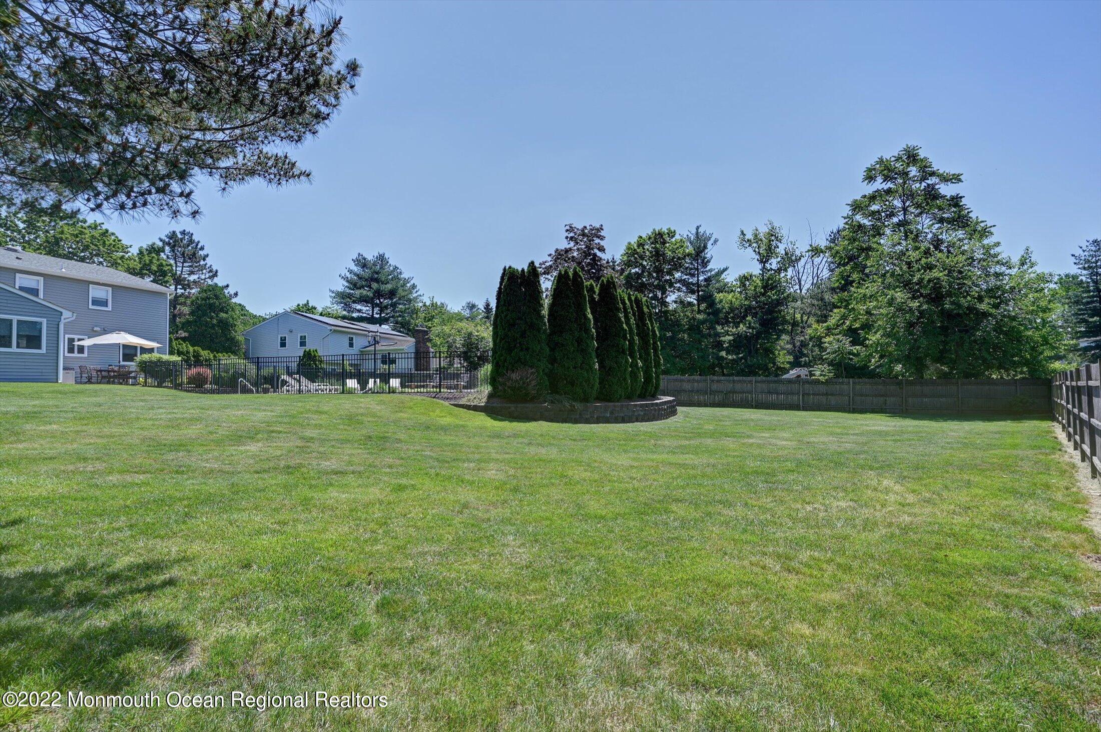 4 Sussex Road Morganville, NJ 07751 - Photo 39 of 55 a view of a grassy field