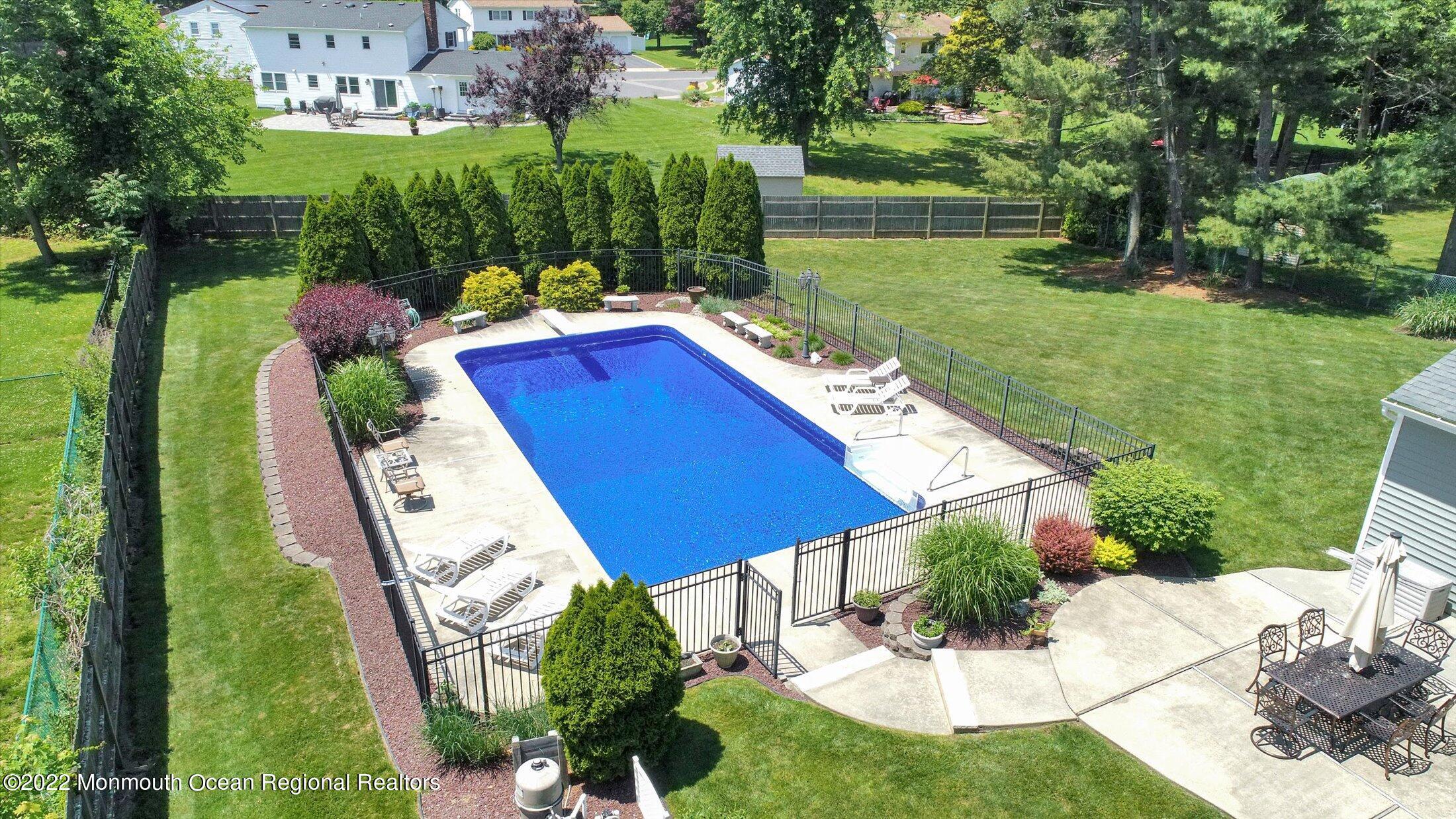 4 Sussex Road Morganville, NJ 07751 - Photo 44 of 55 a view of an house with backyard space and garden