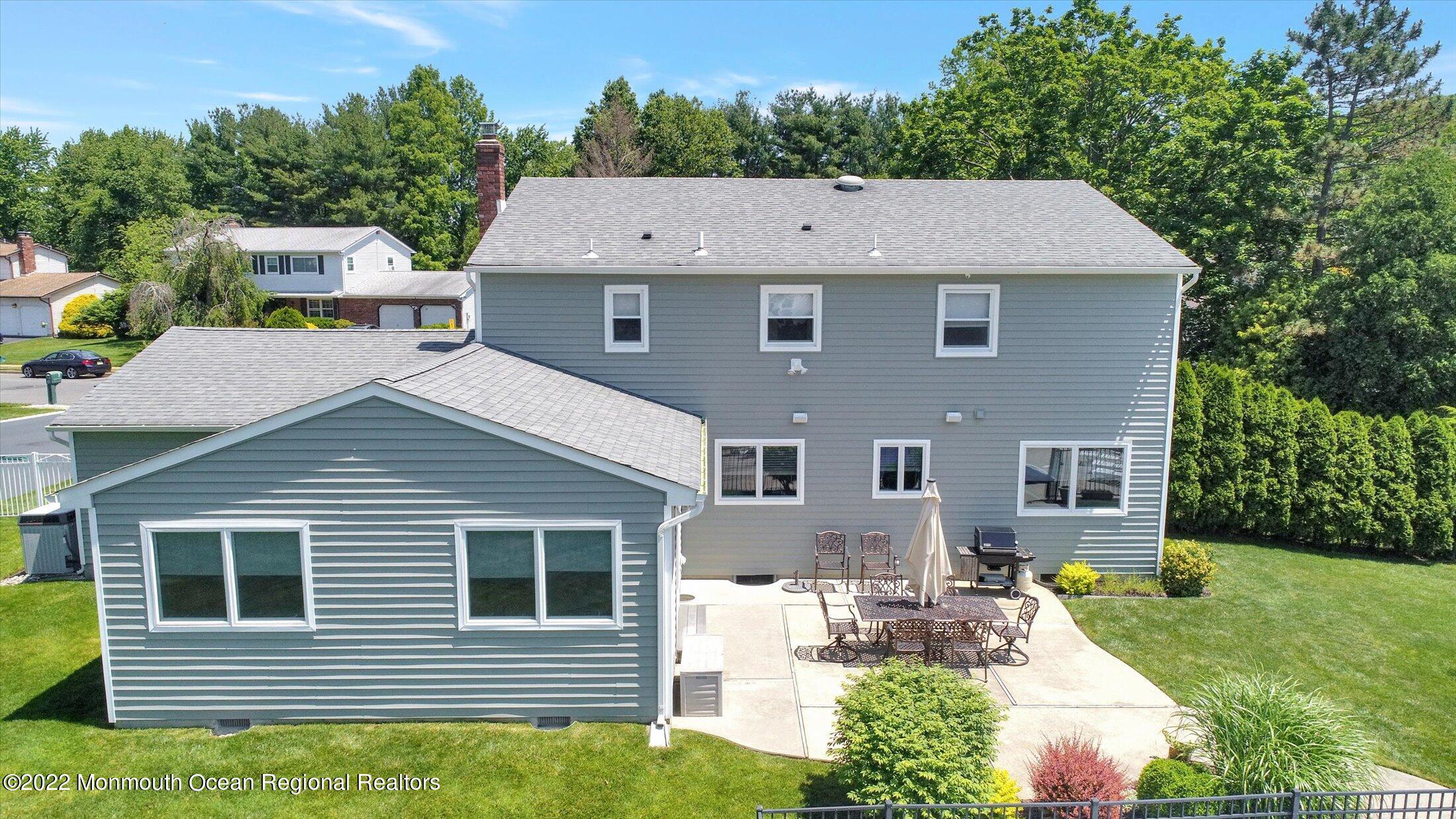 4 Sussex Road Morganville, NJ 07751 - Photo 46 of 55 a aerial view of a house with a yard and potted plants