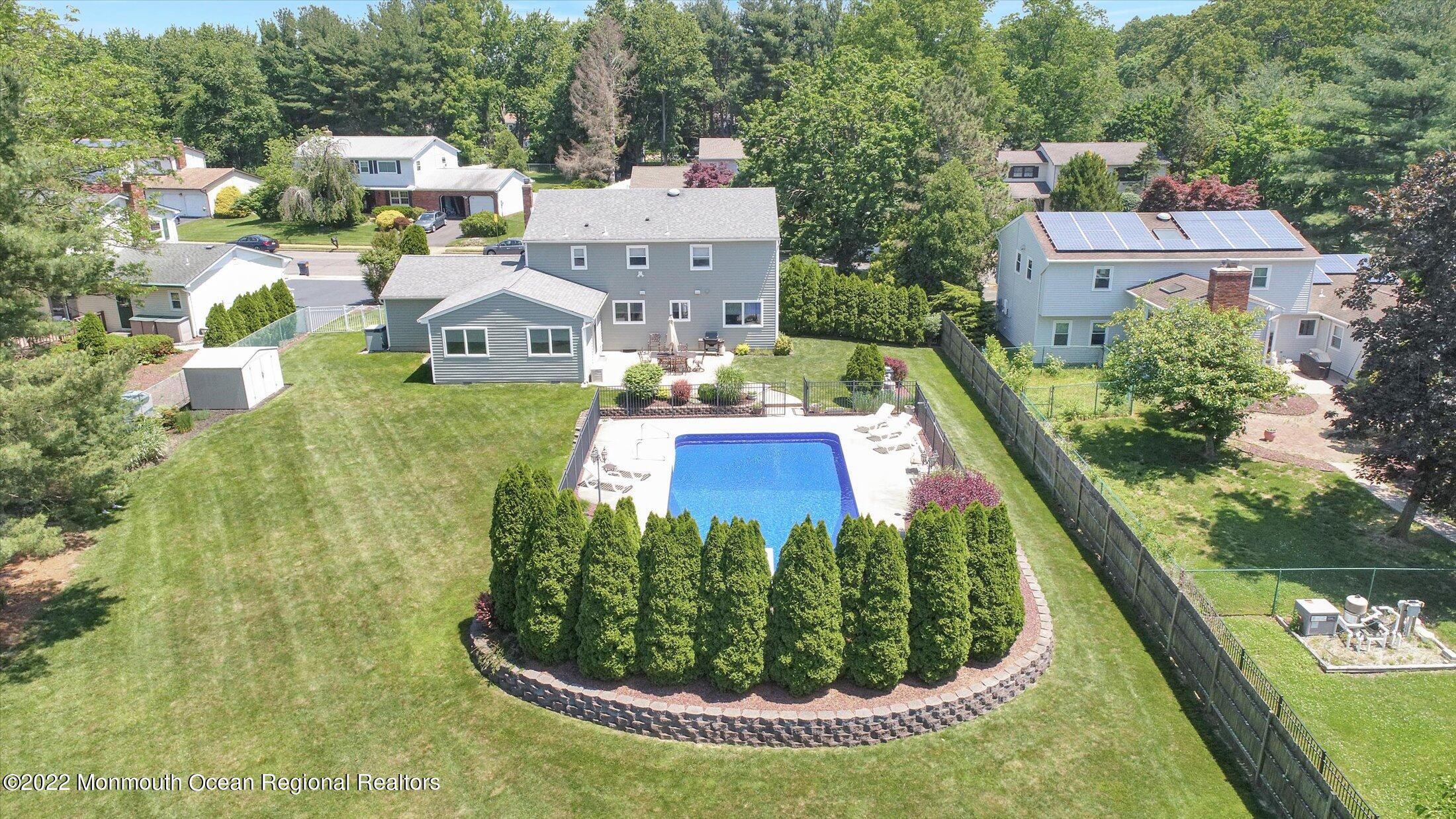4 Sussex Road Morganville, NJ 07751 - Photo 47 of 55 a view of a house with a garden and plants