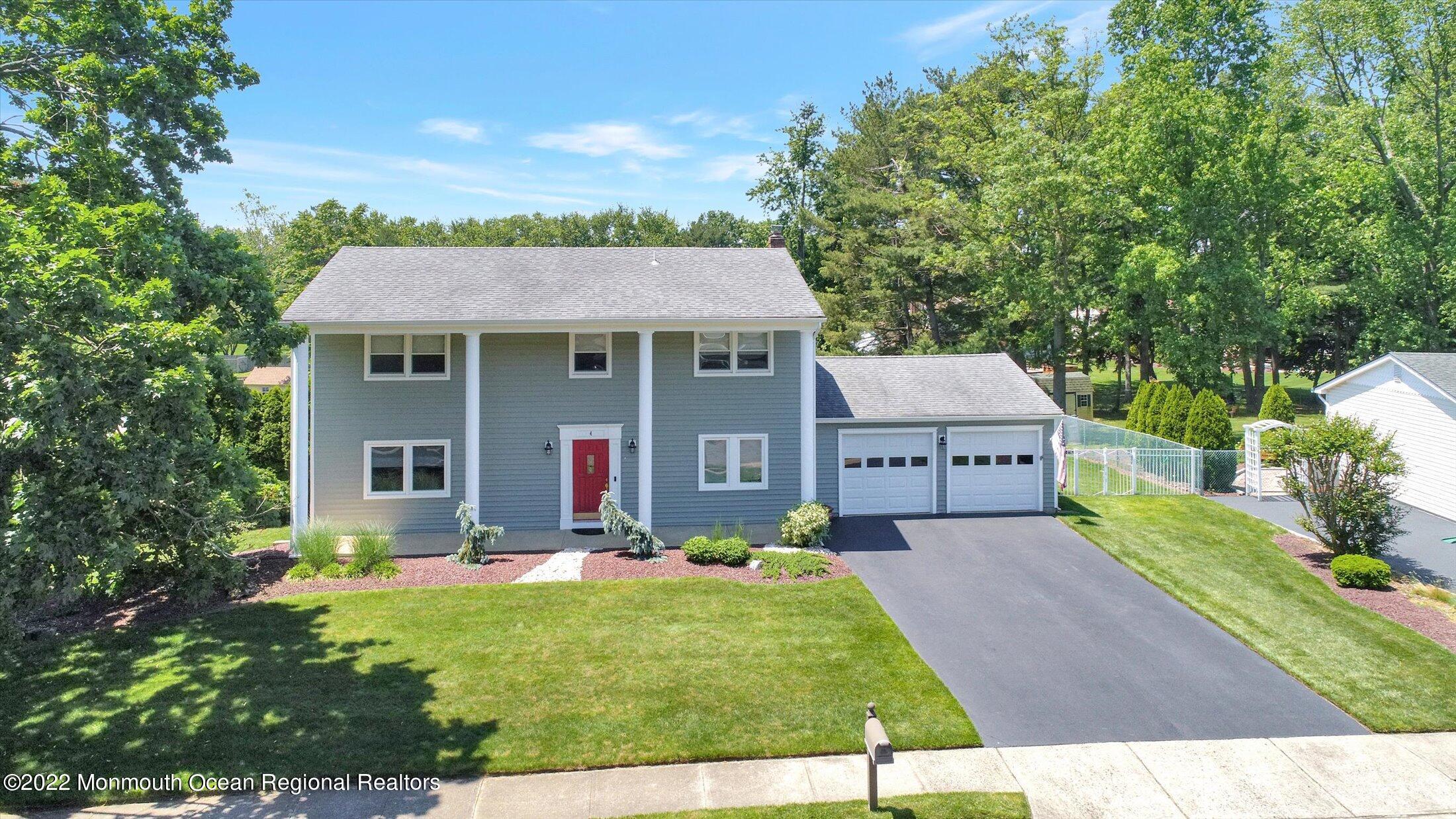 4 Sussex Road Morganville, NJ 07751 - Photo 55 of 55 a front view of a house with a yard
