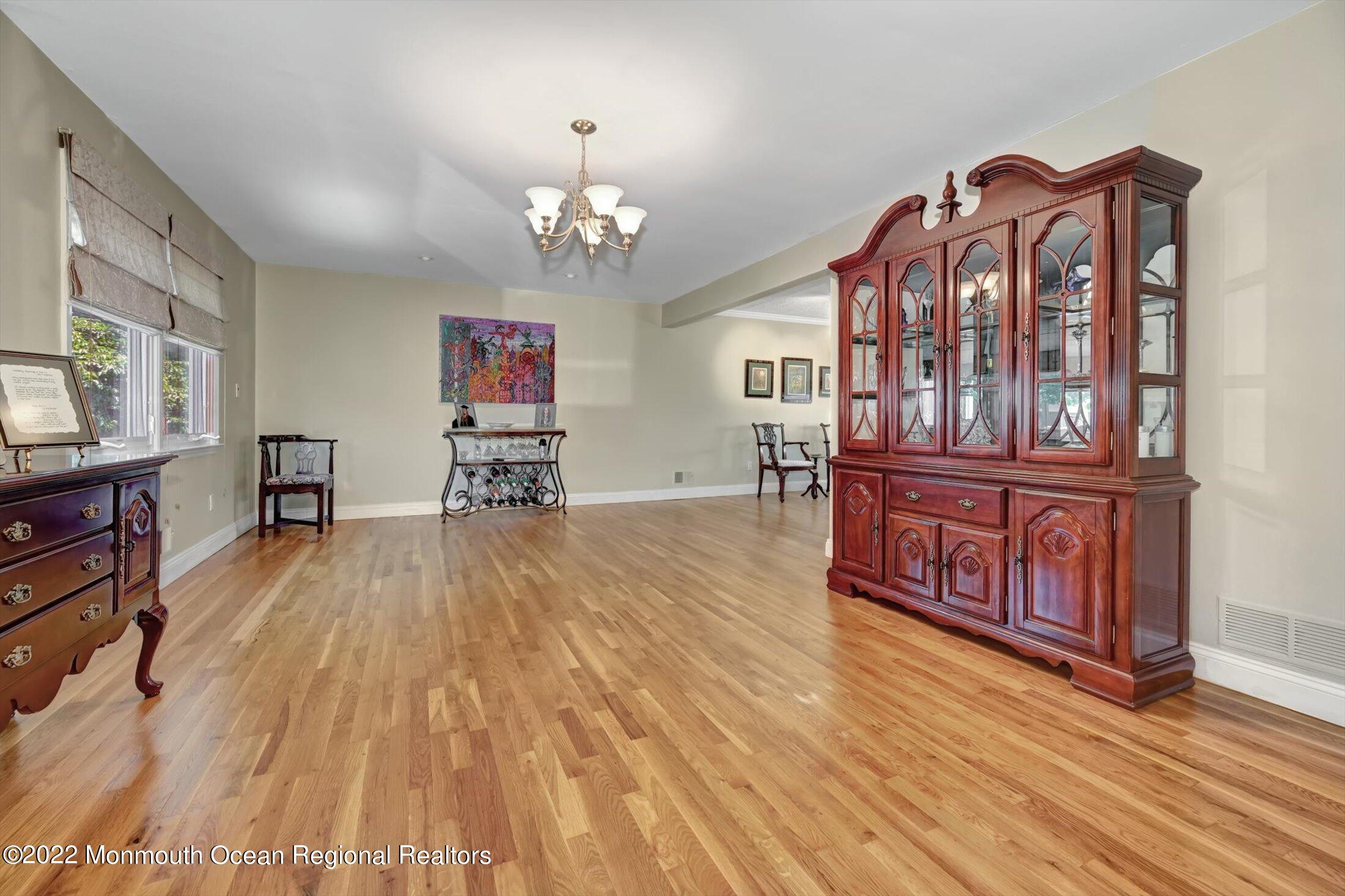 4 Sussex Road Morganville, NJ 07751 - Photo 6 of 55 a view of a livingroom with furniture hardwood floor and a ceiling fan