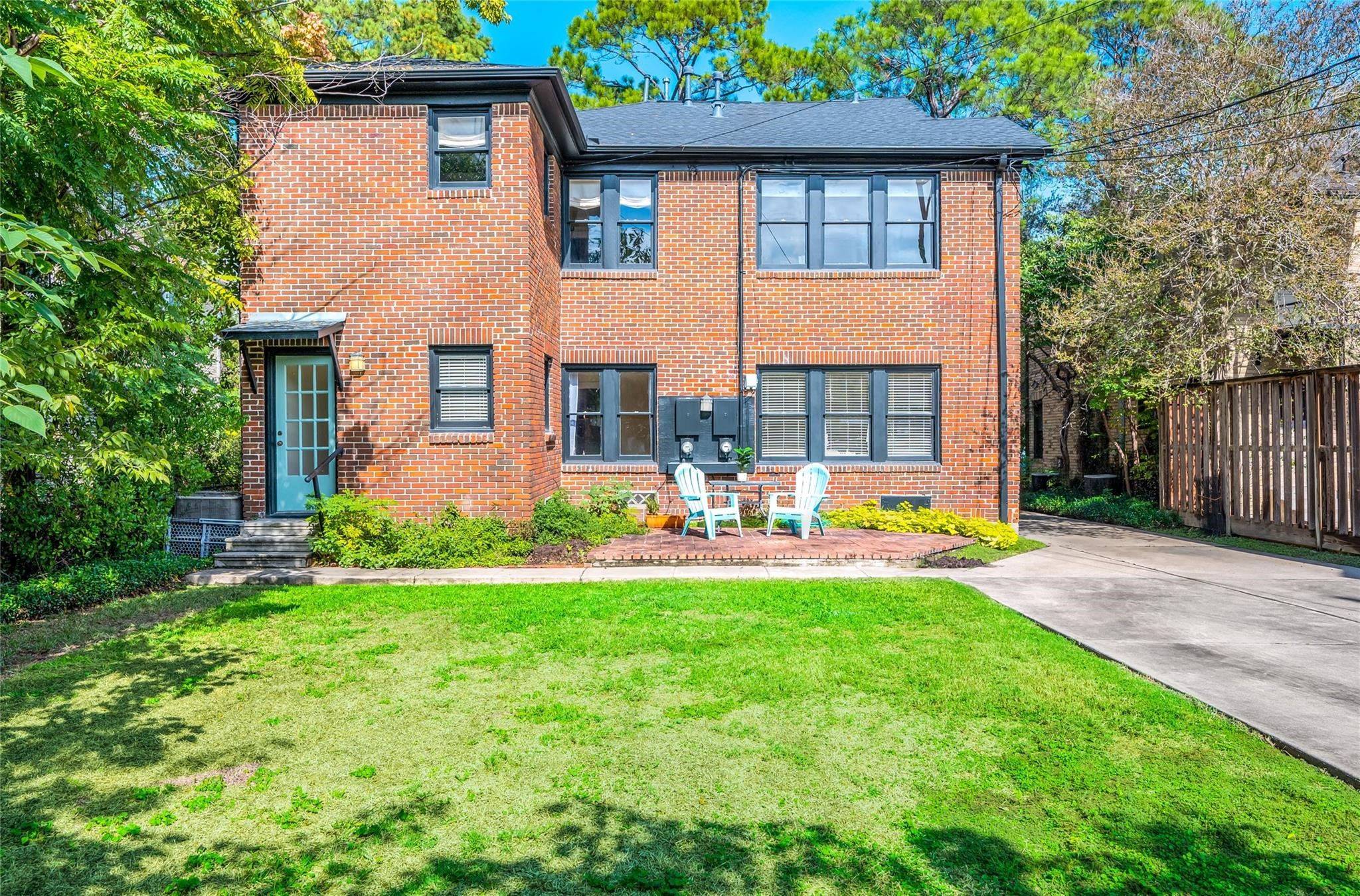 1737 Albans Road, Unit 1 Houston, TX 77005 - Photo 12 of 13 a front view of house with yard and outdoor seating