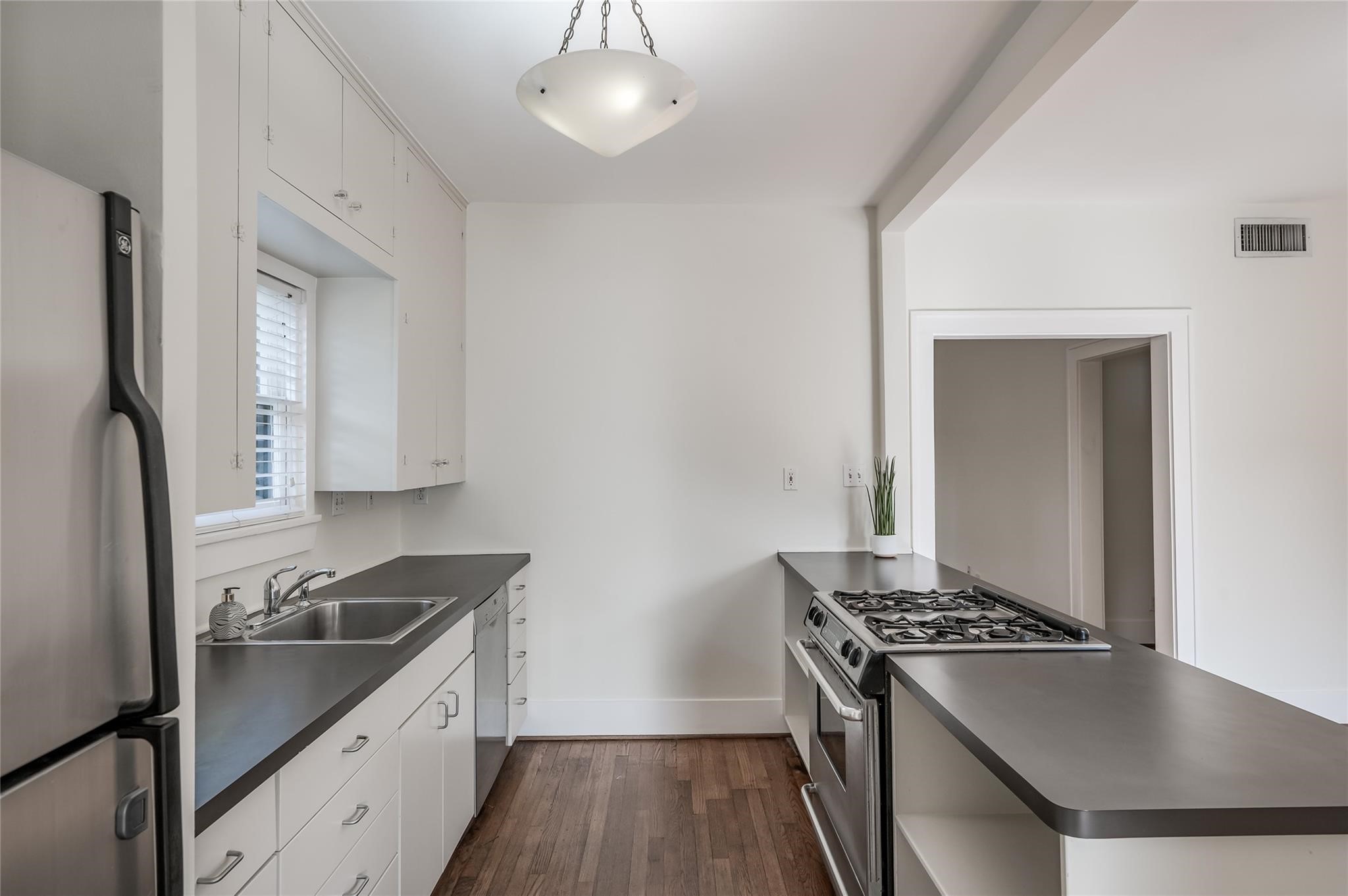 1737 Albans Road, Unit 1 Houston, TX 77005 - Photo 5 of 13 a kitchen with stainless steel appliances granite countertop a stove and a refrigerator
