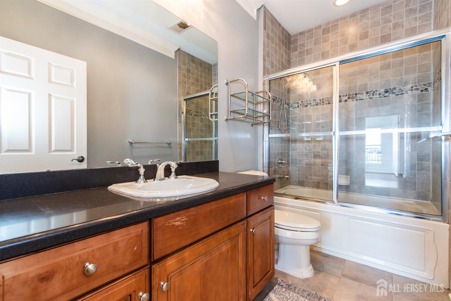 76 Raritan Reach Road South Amboy, NJ 08879 - Photo 11 of 48 a bathroom with a sink toilet and shower