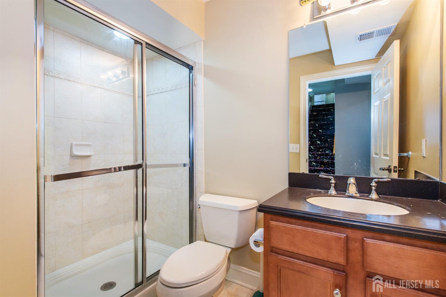 76 Raritan Reach Road South Amboy, NJ 08879 - Photo 15 of 48 a bathroom with a sink a toilet and shower