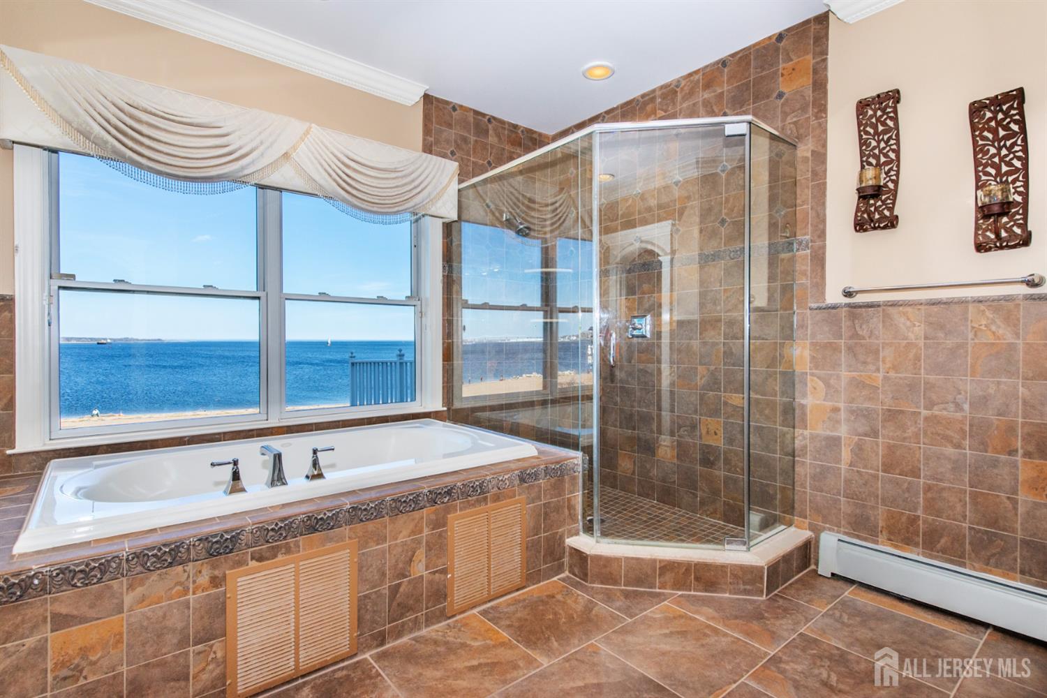 76 Raritan Reach Road South Amboy, NJ 08879 - Photo 16 of 48 a bathroom with a bathtub and a shower