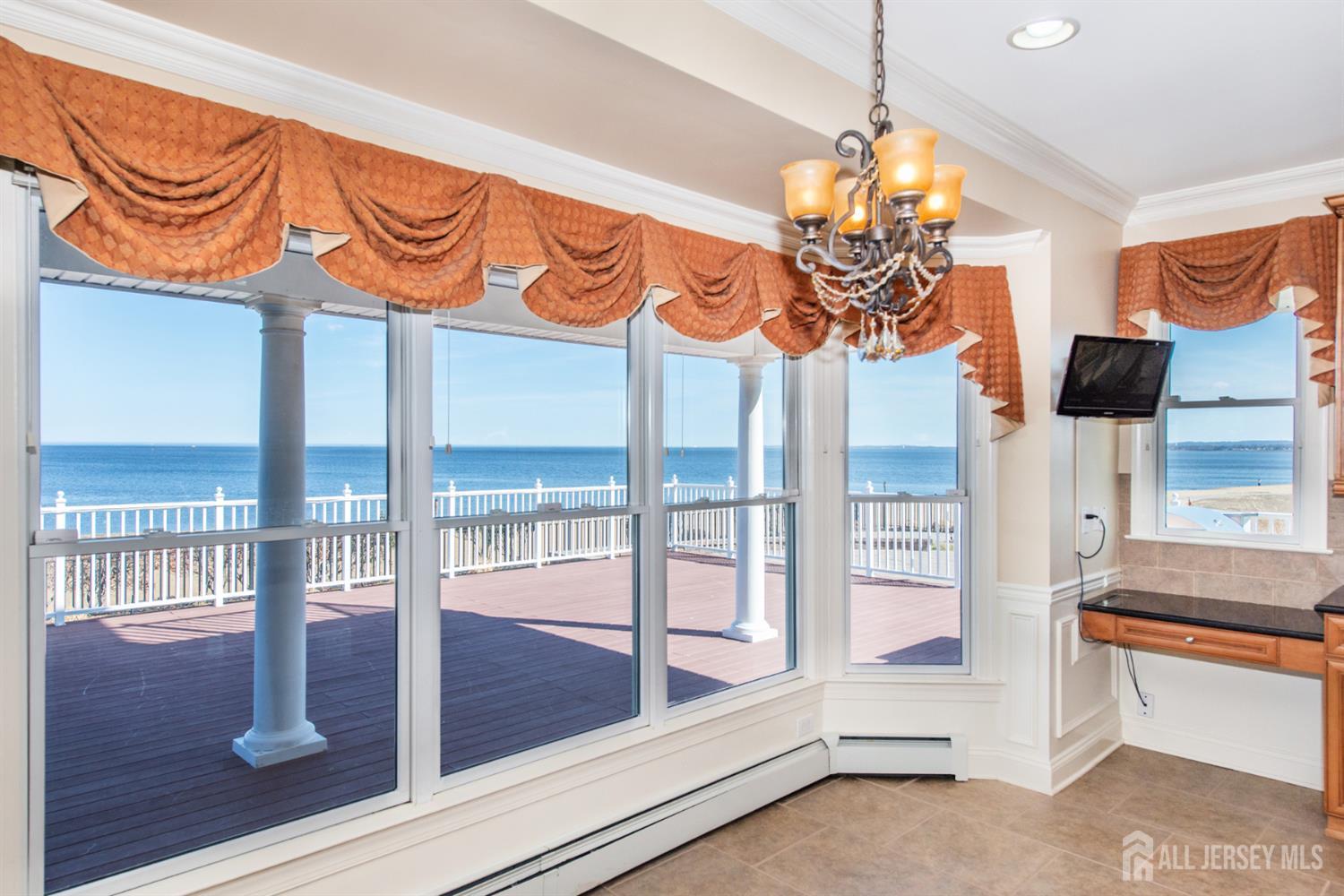 76 Raritan Reach Road South Amboy, NJ 08879 - Photo 19 of 48 a view of entryway kitchen and chandelier