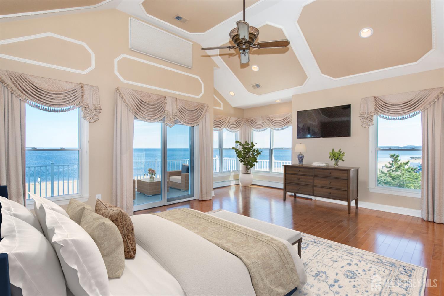 76 Raritan Reach Road South Amboy, NJ 08879 - Photo 29 of 48 a bedroom with a bed and a flat screen tv