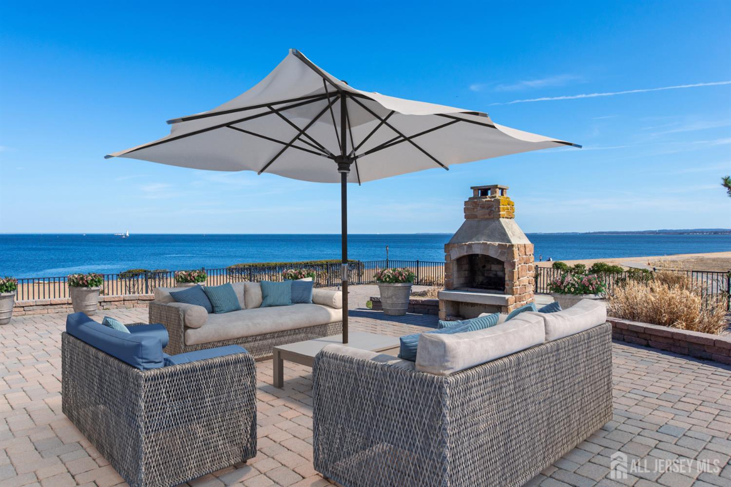 76 Raritan Reach Road South Amboy, NJ 08879 - Photo 33 of 48 a view of a roof deck with couches and umbrella