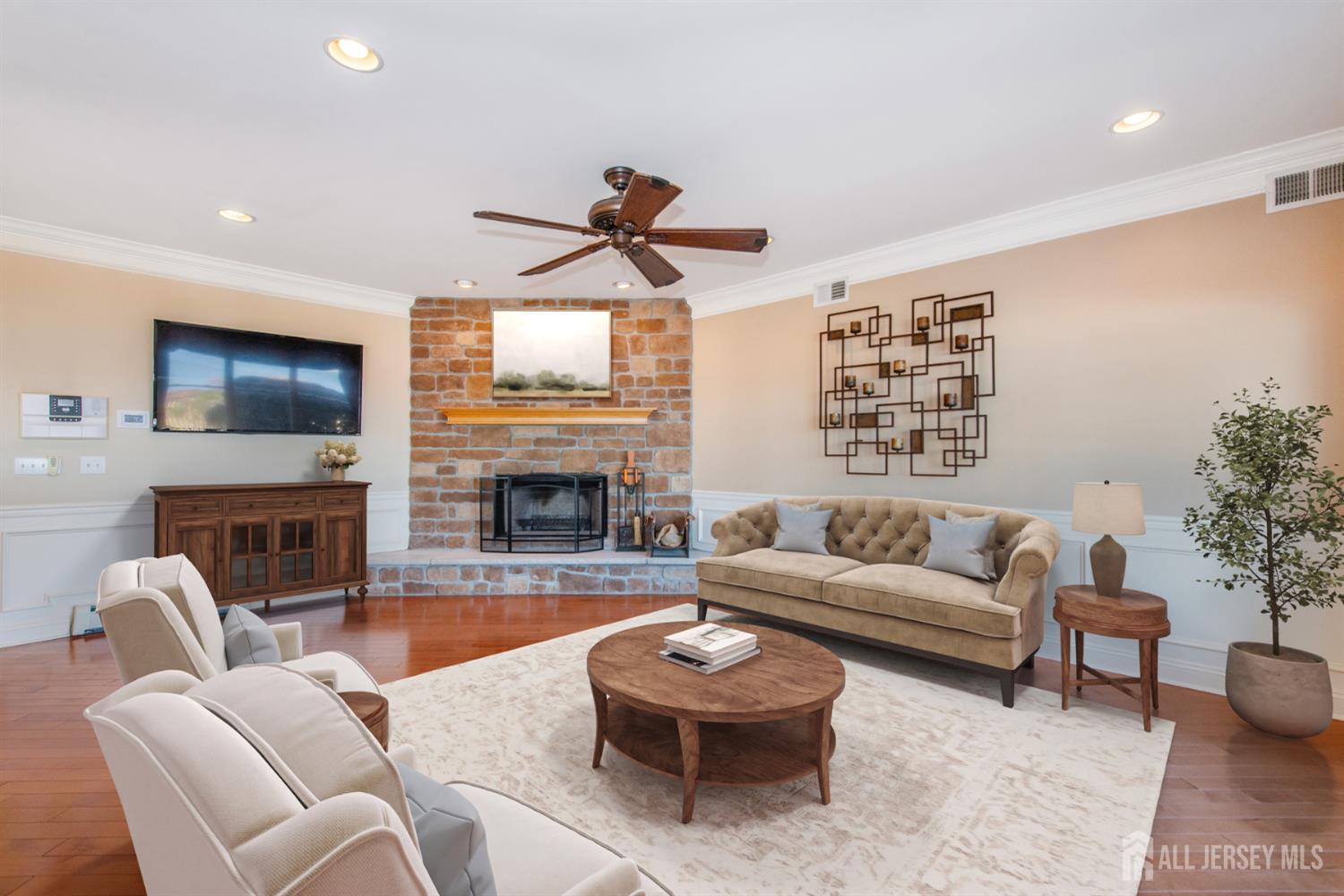 76 Raritan Reach Road South Amboy, NJ 08879 - Photo 40 of 48 a living room with furniture a fireplace and a flat screen tv