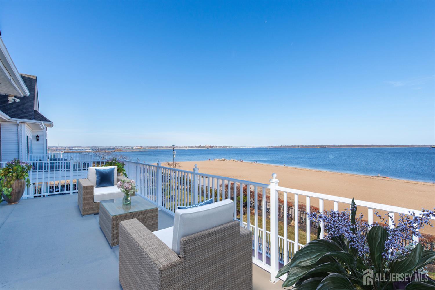 76 Raritan Reach Road South Amboy, NJ 08879 - Photo 41 of 48 a roof deck with a table and chairs