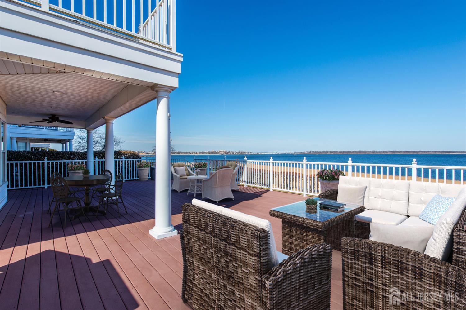 76 Raritan Reach Road South Amboy, NJ 08879 - Photo 45 of 48 a view of a roof deck with dining table and chair couches with wooden floor