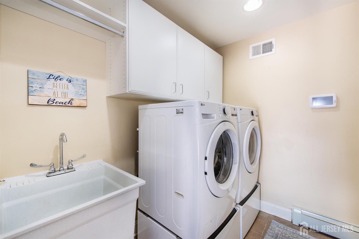 76 Raritan Reach Road South Amboy, NJ 08879 - Photo 8 of 48 a utility room with dryer and washer