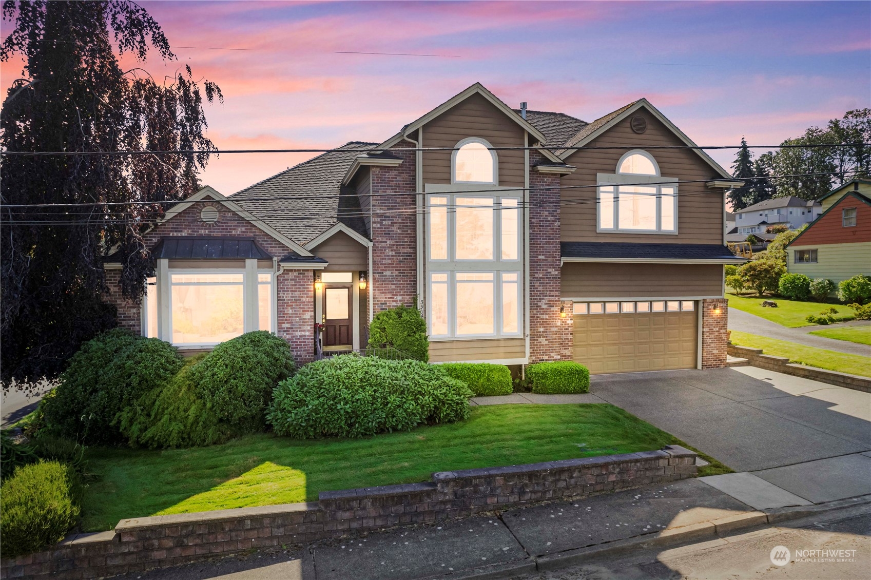 3904 Park Avenue North Renton, WA 98056 - Photo 1 of 40 a front view of a house with a yard and potted plants