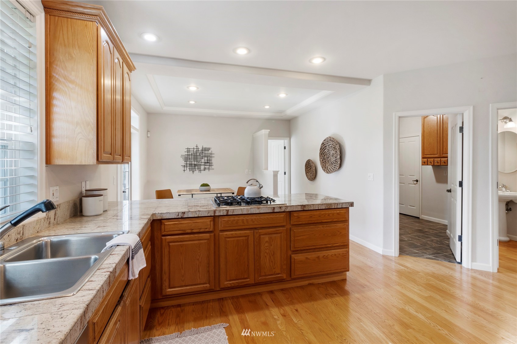 3904 Park Avenue North Renton, WA 98056 - Photo 13 of 40 a kitchen with stainless steel appliances granite countertop a sink and a stove