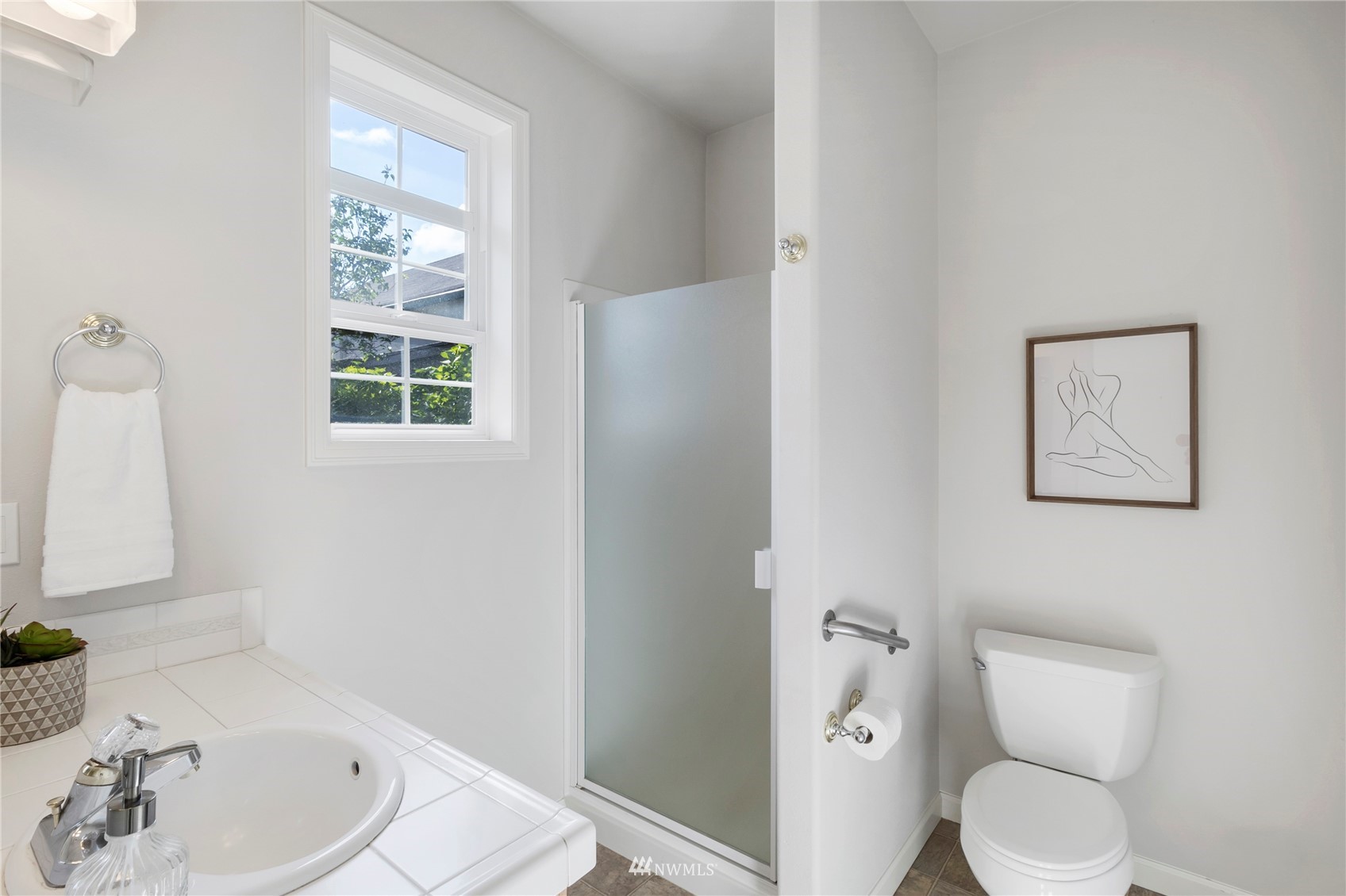 3904 Park Avenue North Renton, WA 98056 - Photo 22 of 40 a white toilet sitting next to a bathroom sink