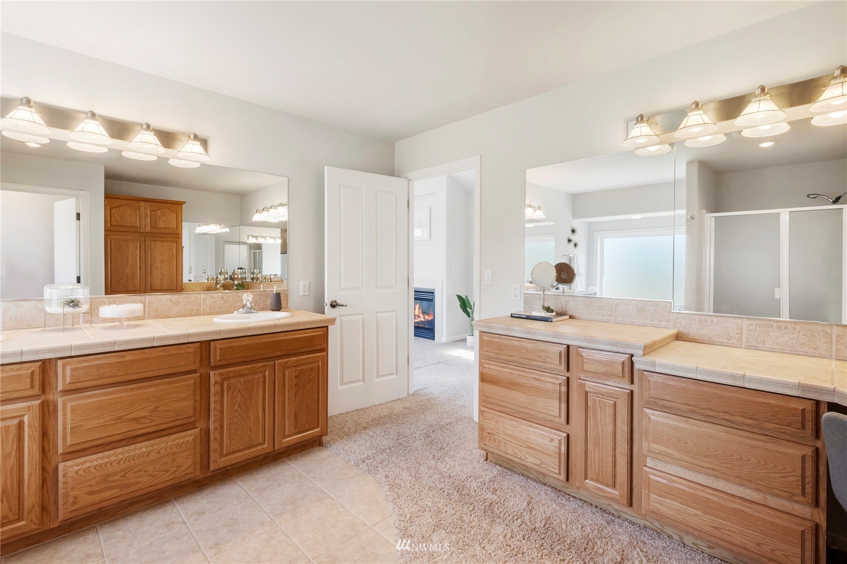3904 Park Avenue North Renton, WA 98056 - Photo 28 of 40 a spacious bathroom with a granite countertop sink a mirror and a