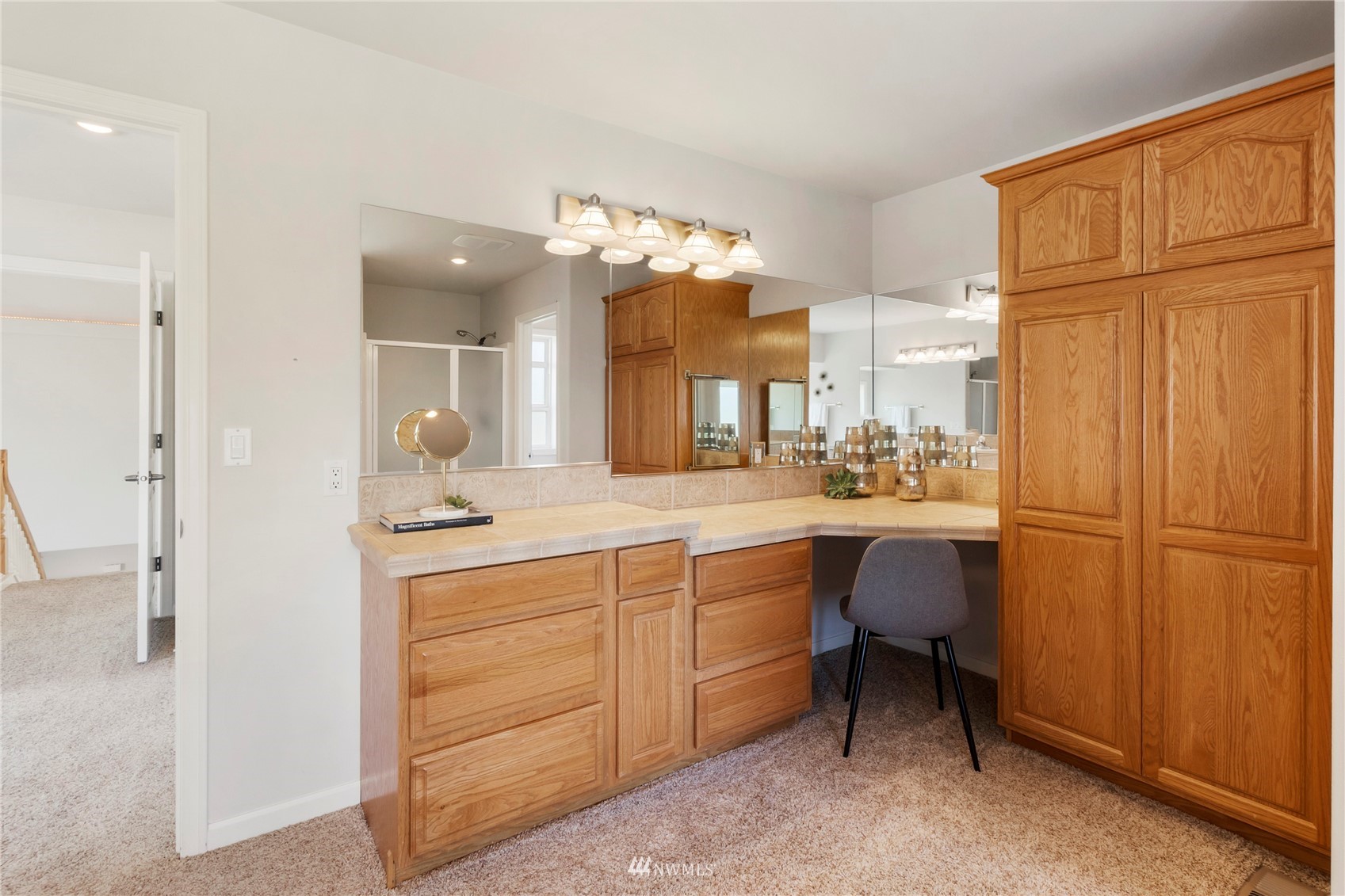 3904 Park Avenue North Renton, WA 98056 - Photo 30 of 40 a spacious bathroom with a granite countertop sink a toilet and a mirror