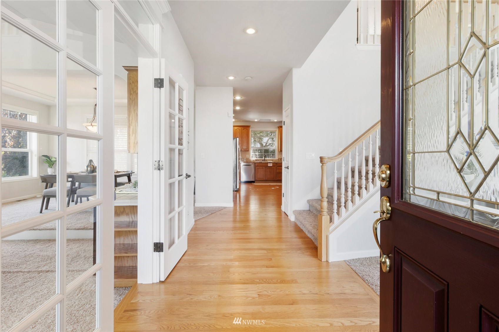 3904 Park Avenue North Renton, WA 98056 - Photo 3 of 40 a view of a hallway with wooden floor and windows