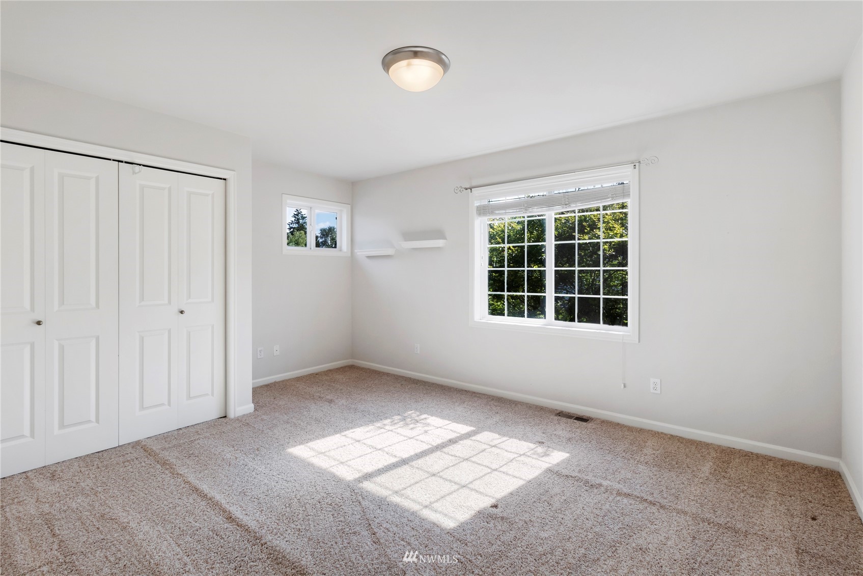 3904 Park Avenue North Renton, WA 98056 - Photo 34 of 40 an empty room with windows